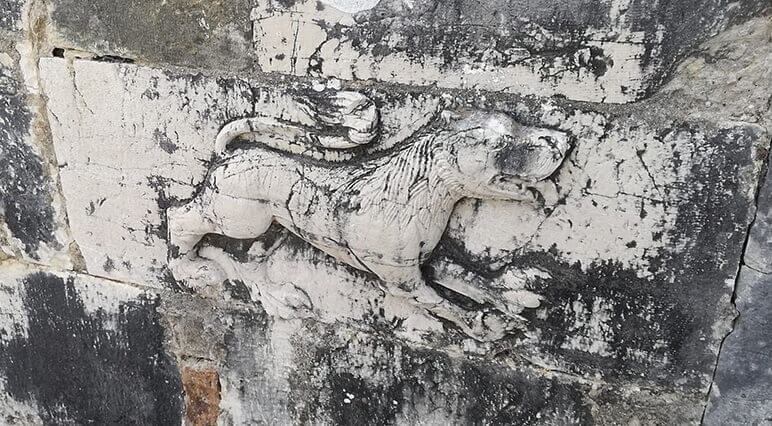 Sculpture of a lion in the wall of the Church of Saint Nicholas in Mesopotam