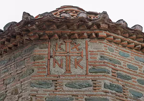 Monogram and brickwork on the exterior walls of the church of the Vlatades Monastery, Thessaloniki