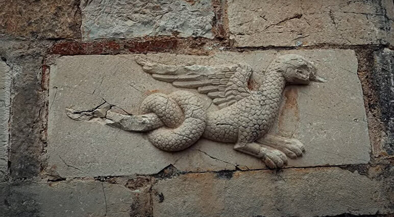 Byzantine era sculpture of a dragon in the wall of the Church of Saint Nicholas in Mesopotam