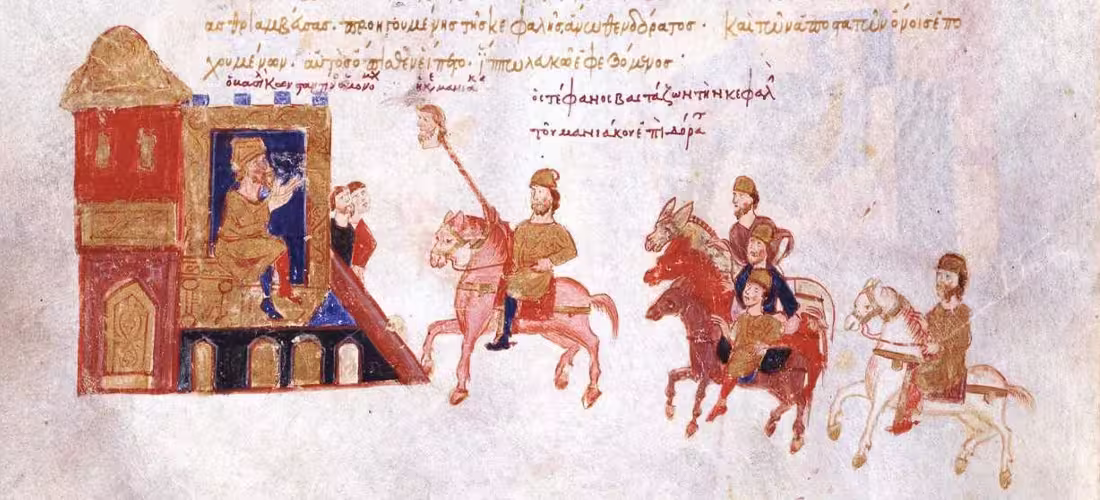 In the streets and Hippodrome of Constantinople, the eunuch Stephanos Pergamenos displays the severed head of the rebel Maniakes before Emperor Constantine IX. Followed by his captured partisans, historical accounts record that the rebels were paraded backward on donkeys as a mark of public humiliation, though the artist omits this detail in this illumination from the Skylitzes manuscript.